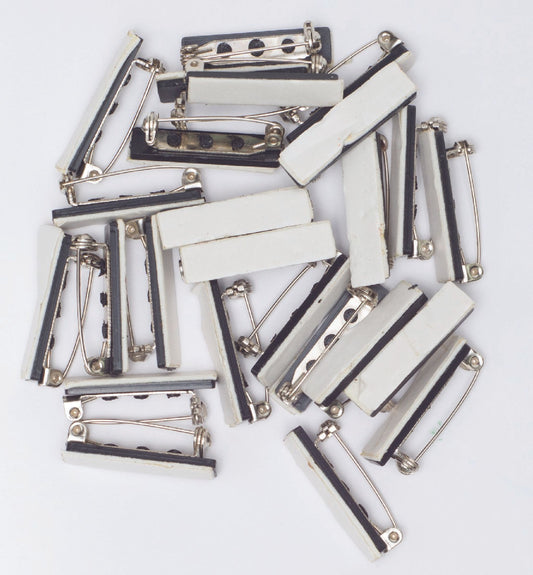 Attaches pour broche